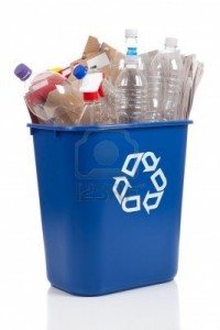 5384861-an-overflowing-blue-recycle-bin-full-of-plastic-bottles-newspapers-and-boxes-with-the-recyle-symbol-