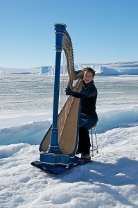 Harpist Alice Giles in Antarctica. Photo by Glenn Jacobson, Australian Antarctic Division