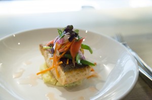 Salmon fillet with horseradish cream and pickled vegetables.
