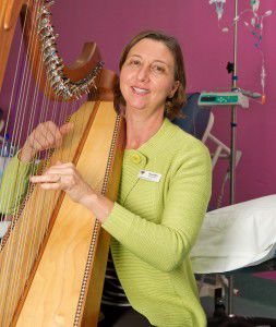 Therapeutic harpist Alison Ware... “The harp can be uplifting, light and bright, or in the minor key it can allow people to relax and let go.” Photo by Brent McDonald