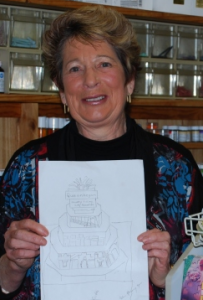 Baker Lorraine Kiewiet with her plan for the five-layer birthday cake.  