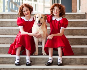 Alternating Annies… Lydia Milosavljevic,left, and Clare Pinkerton with dog Maverick. Photo by Captured Moments Photography.
