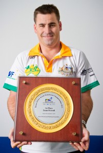 Australian wakeboarding team manager Leigh Baguley and that shiny gold plate. Photo by Brent McDonald