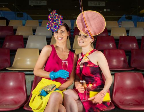 Top photo: Ariel, left, wears ASOS singlet top, $30; Oxford skirt, $60; Olga Berg clutch, $110; and Biretta and Busby rainbow check fascinator, $260. Gloves are stylist’s own. Kate wears a Karen Millen dress, $400; Kate Hill wallet, $19.95; and Biretta and Busby flamingo disc with ostrich quill fascinator, $260. Clutch and gloves are stylist’s own.