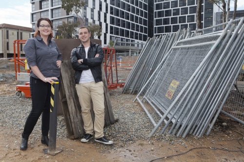 University of Canberra students Alexandria Garlan and Mitchell Harmer at a construction site on campus. Photo: Michelle McAulay