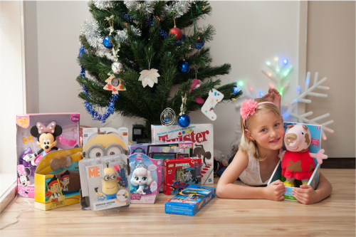 Evie Tattam,7, and her gifts for the Giving Tree… spent a long time choosing everything and tried to get a range of things for boys, girls and different ages. Photo by Holly Treadaway 