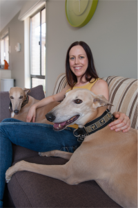 Natalie Stirling with her two pet greyhounds… “Greyhounds are easy to look after, don’t take up much space and love snuggling up on the sofa.” Photo by Holly Treadaway 