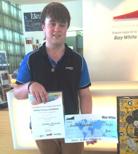 Brandon Mackintosh  with his certificate and cheque