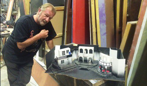 Ian Croker, probably Canberra’s best-known actor, in the role of set designer for “Evita”.