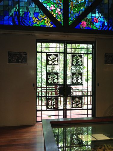 Stained glass window in Sandakan memorial park show the Australian waratah and English rose