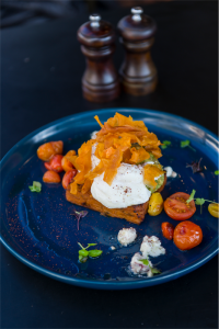 Pumpkin tortilla… a big serve of pumpkin mash that comes with poached eggs, smashed avo, oven-roasted tomatoes and the tortilla. Photo Andrew Finch 