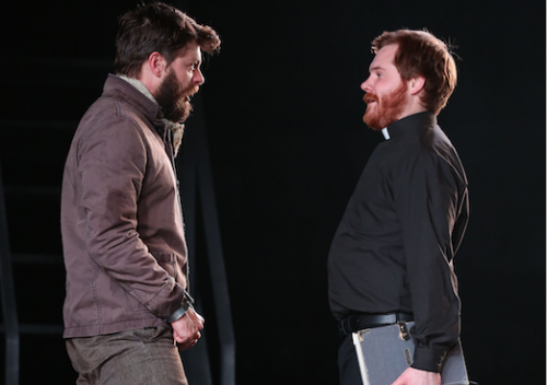 Steven Rooke, left, as Ned Kelly and Kevin Spink, dressed as a priest, as his brother Dan.… “I had a desire to find Ned Kelly as I experienced him rather than as a nationalistic figure,” says playwright Matthew Ryan. Photo by Rob MacColl.