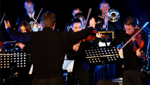 Chris Latham conducts "August Offensive," by Andrew Schultz at Anzac Cove in 2013. Photo courtesy of DVA 