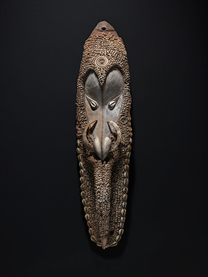 Mai mask  mid 20th century  wood, shell, clay, fibre, tusk, ochre, porcelain  76.5 x 16 x 12 cm  National Gallery of Australia, Canberra  Purchased 2014. 