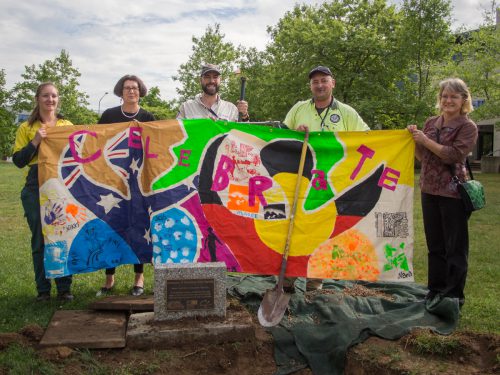 Left to right: Gabrielle Evans (TAMS) Dira Horne (CEO BCS), Brian Bathgate (TAMS) , Francesco Mazzoli (TAMS) and Jane Carder (TAMS) holding up a banner retrieved from the Time Capsule. 