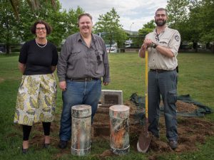 Dira Horne (BCS CEO) Damien Haas (Belconnen Community Council and Brian Bathgate (TAMS) with the freshly unearthed time capsule