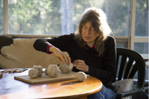 Fiona Hall at work, Image courtesy of the Australia Council for the Arts