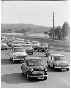 Cars exit Canberra in the ‘60s… holiday traffic would be gridlocked all the way over Queanbeyan's old timber bridge.