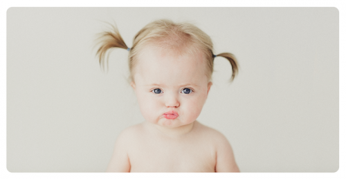 Katie Kolenberg’s winning portrait of a local nine-month old baby girl, entitled “Kissy Lips”. 