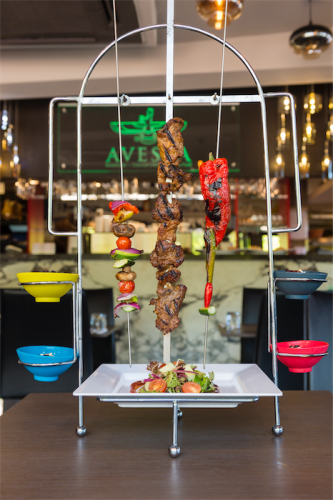 The signature dish at Avesta, the “Kurdish-style TKA” – skewered beef, lamb, chicken or kofta presented on long skewers, loaded with meat and veggies, hanging from a rather tall structure that looks splendid on the table. Photo by Andrew Finch 