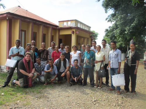Dr Rob Sharwood, with red scarf, left, and David Johns, black scarf, with their class of East Timor science teachers in Maliana. 