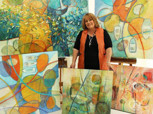 Tracey Creighton with 'Unleashing the Flood' paintings.