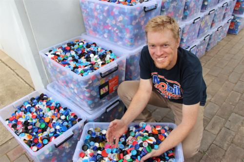 Tim puts aside chronic pain to gather lids for kids