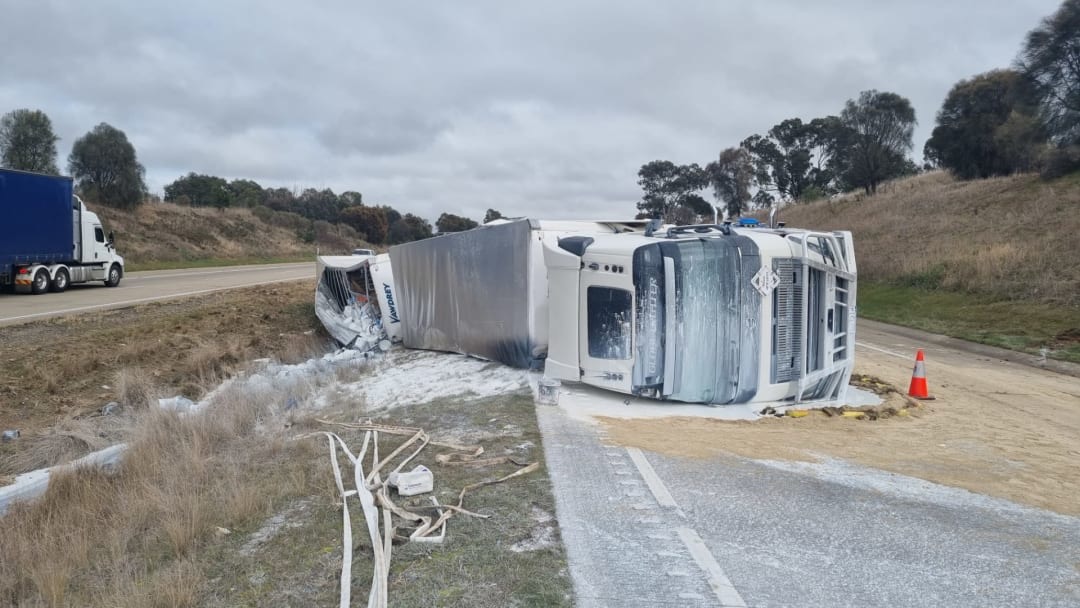 Truck crash covers highway in paint