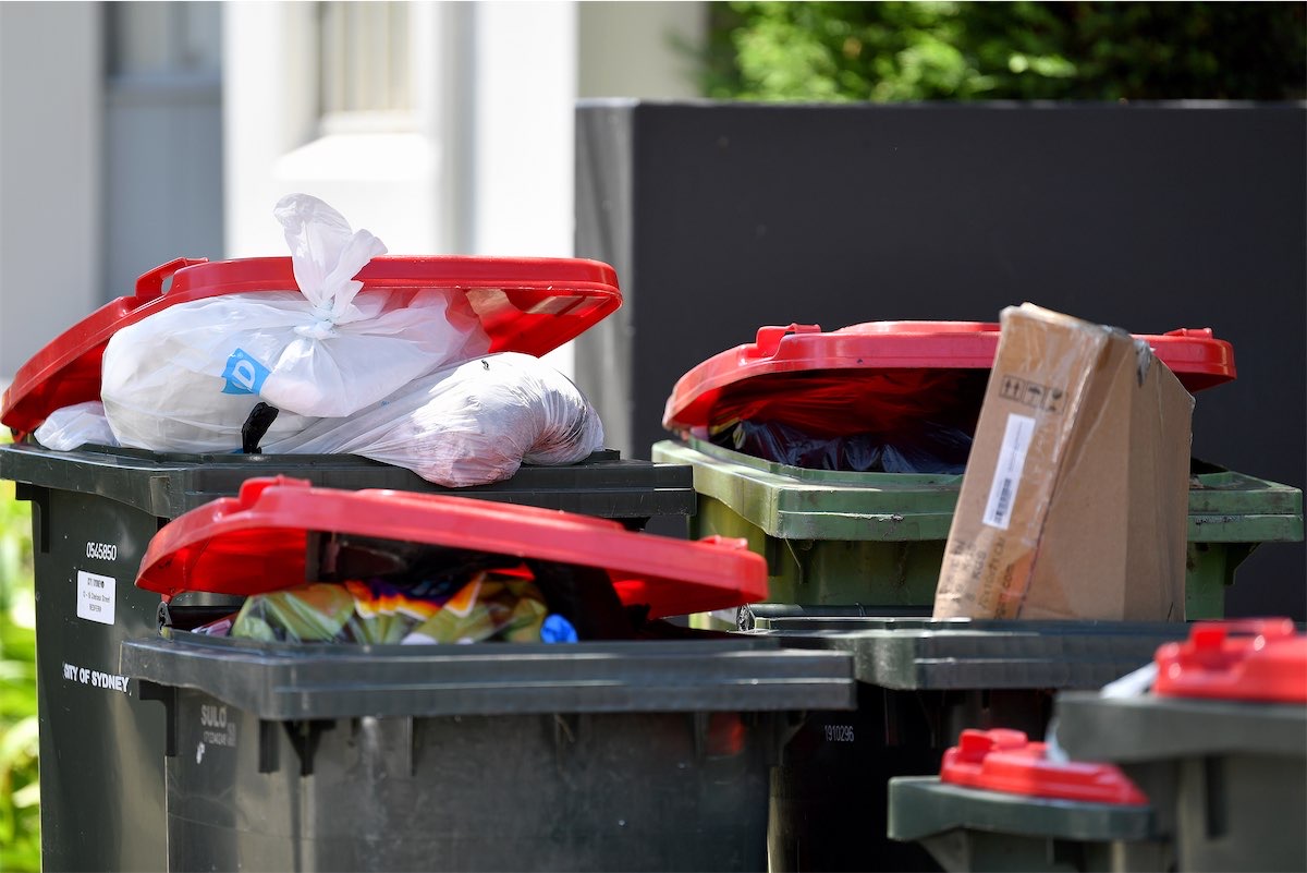Bins uncollected as garbos strike in Canberra and Sydney