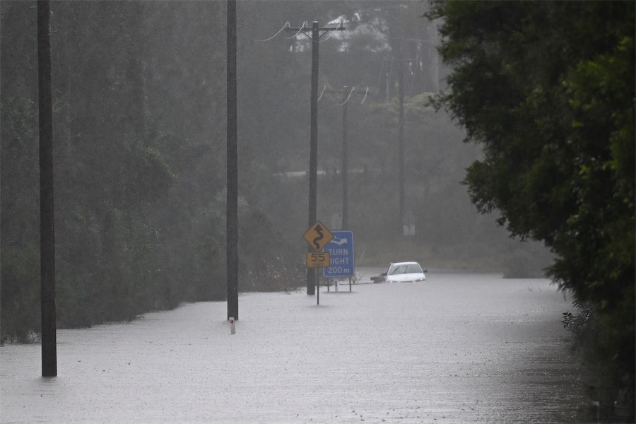 Rain system moves off coast, leaving flood risks behind