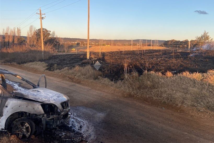 Mystery car in the midst of Beard grassfire