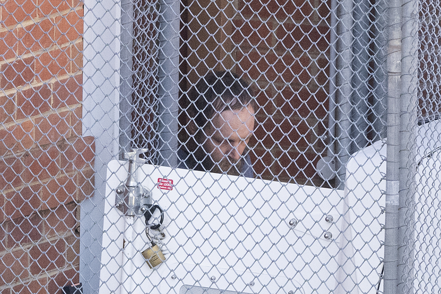 Silent, staring: alleged MP attacker appears in court